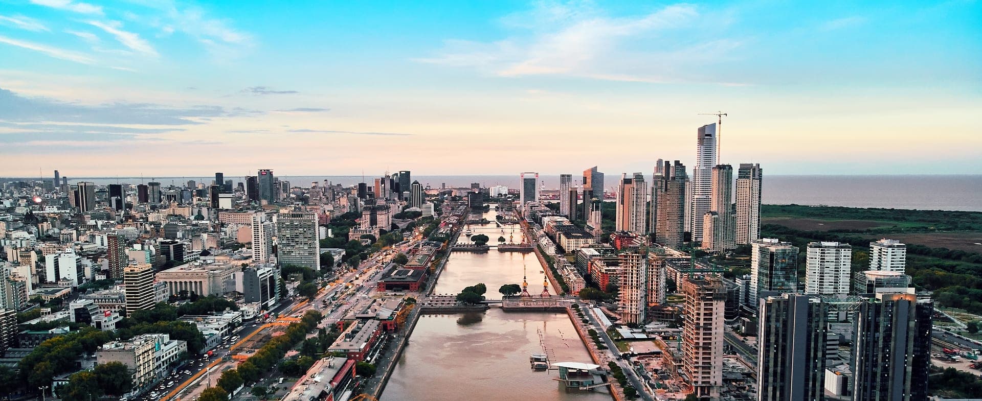 The red-brick docks and glass towers of Puerto Madero in Buenos Aires, seen from the air at first light